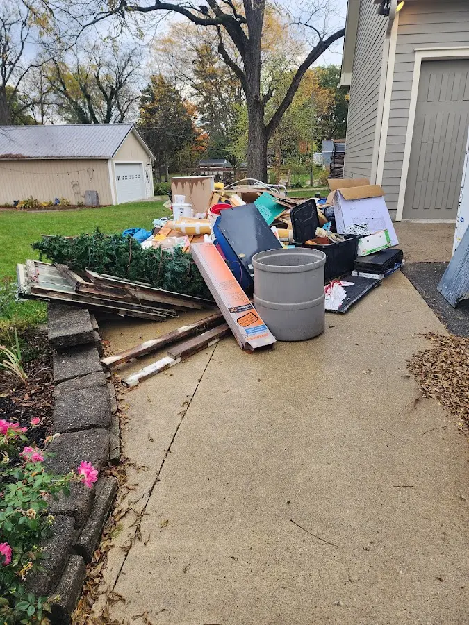 Dumpster being loaded with debris for 30 Yard Dumpster Rental in Chehalis